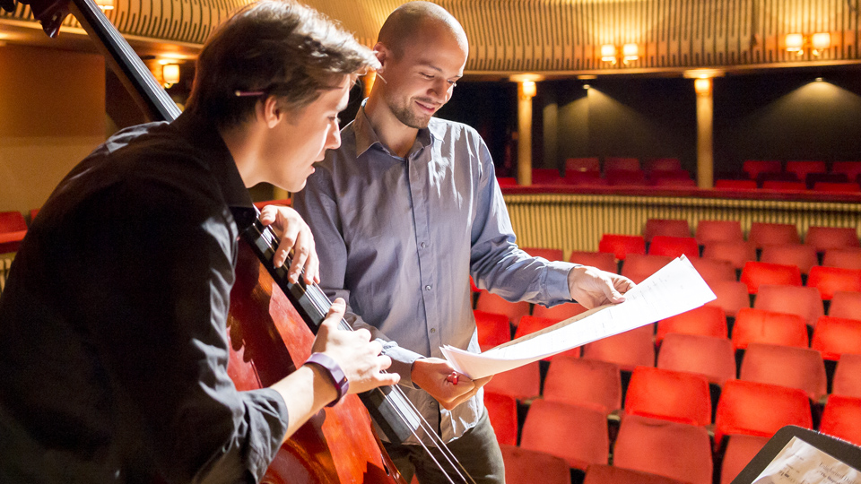 An RCM composer working with a double bassist in the Britten Theatre